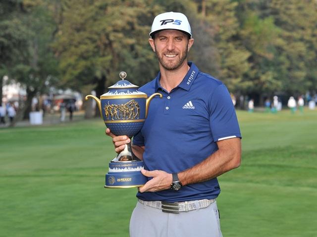Dustin Johnson with the WGC-Mexico Championship trophy